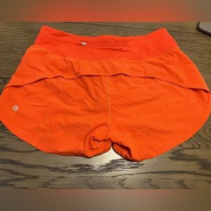 Lulu show. Size 8. Small mark on rear seen in 2nd pic. Fun orange colour